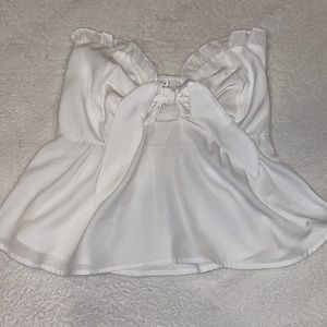 White strapless bust top with tie front opening